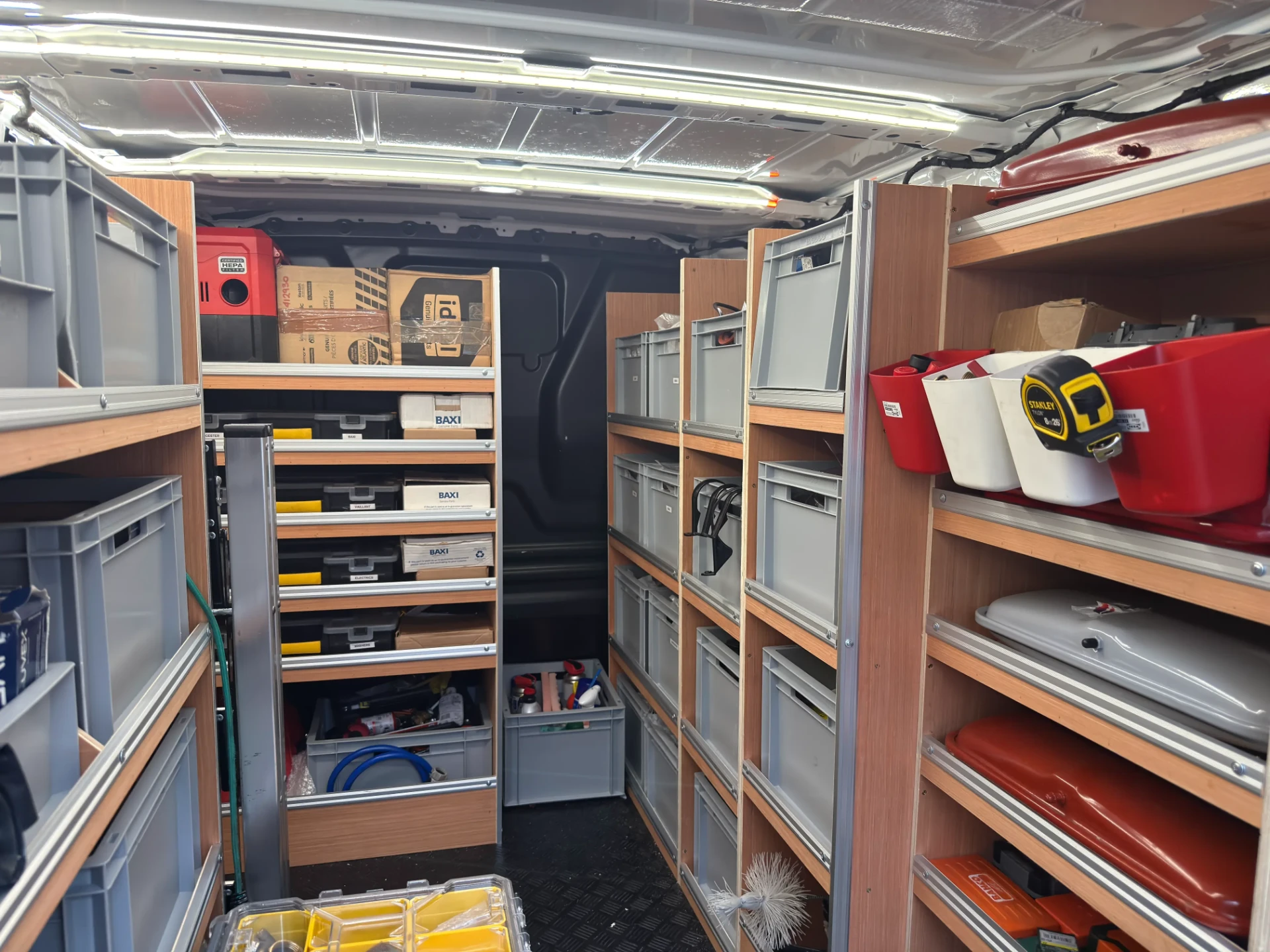 Organised stock of common boiler parts carried in the Newcastle Boiler Maintenance service van
