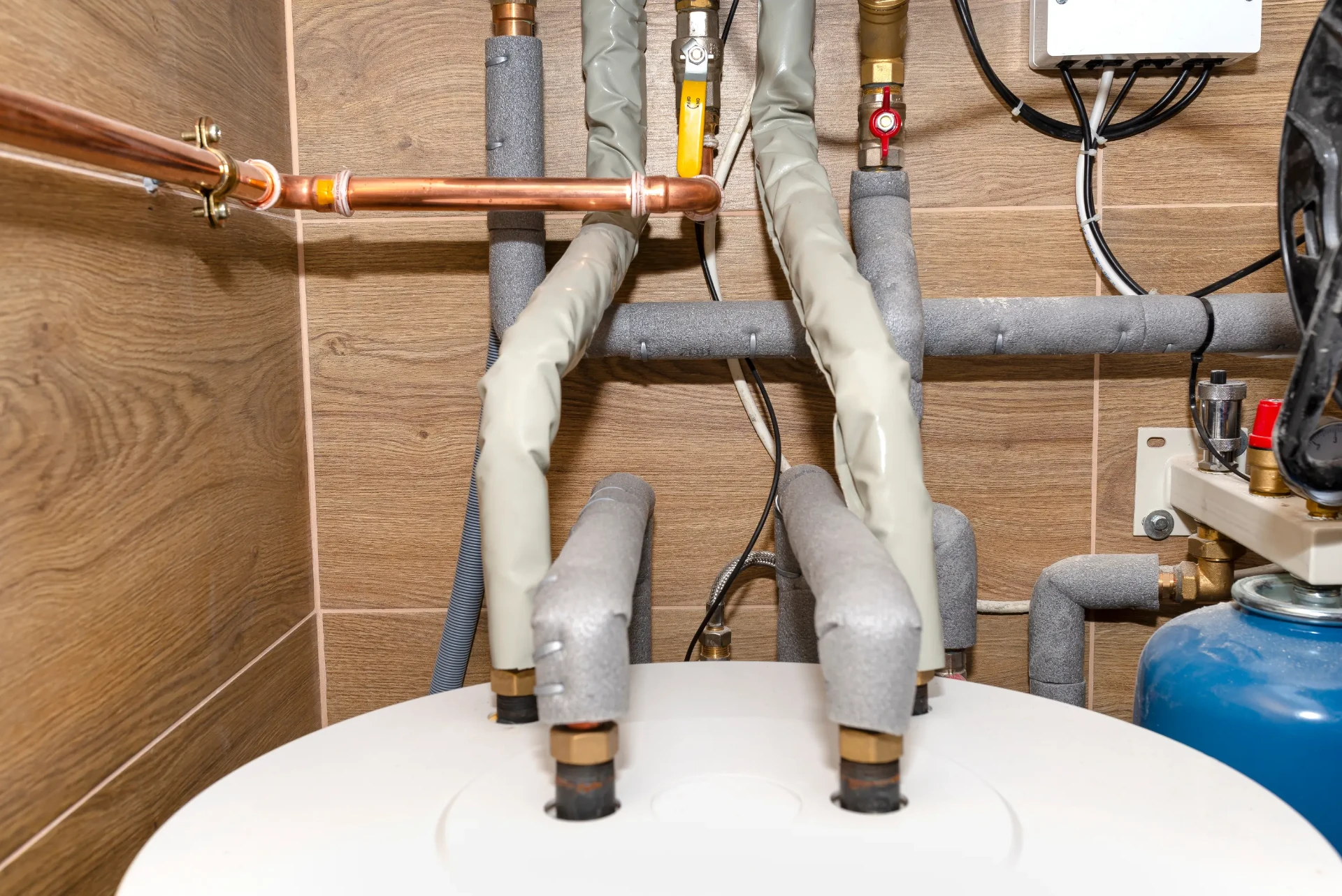 Hot water cylinder, insulated pipework and expansion vessel in a Newcastle upon Tyne home