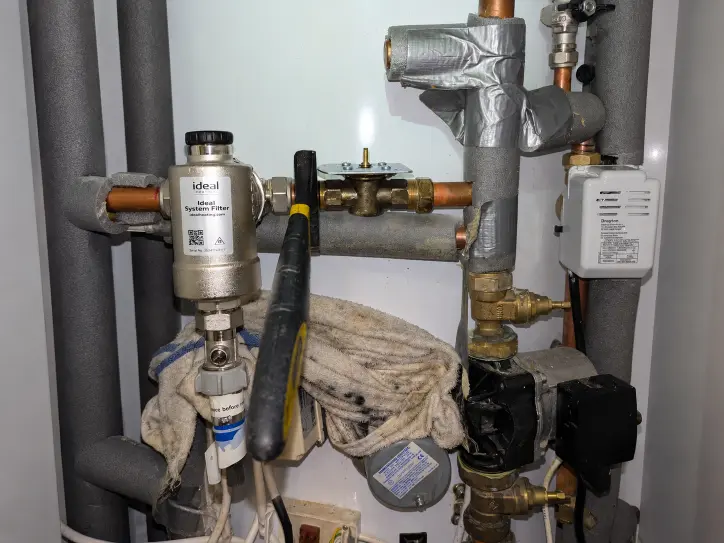 Heating system valves and controls connected to insulated pipework
