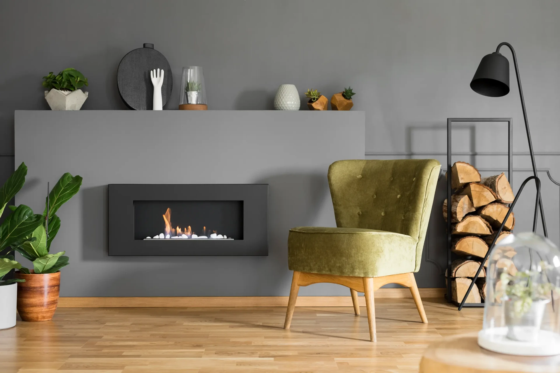 Modern wall-mounted gas fire alight in a Newcastle upon Tyne living room